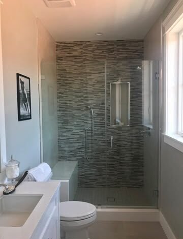 Frameless shower glass with mirror niche by NG Windows and Doors